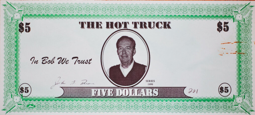 A Hot Truck five-dollar gift certificate sporting Bob Petrillose's face and "In Bob We Trust"