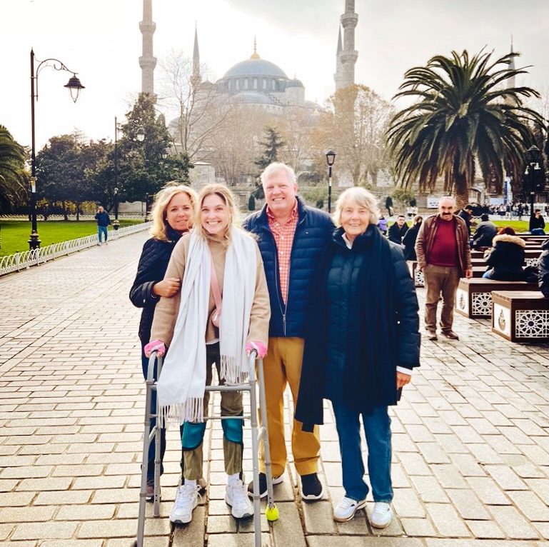 Nina Bachich using a walker while on a trip with her family