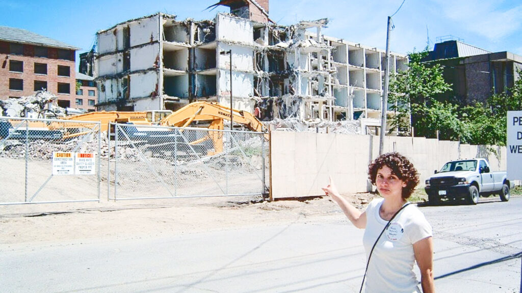 Nicole Vantuno Wagner ’94, visiting campus for her 10th Reunion, points to her former room in a U-Hall that is in the process of being demolished