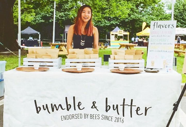 Jamie Kim as an undergraduate student staffing a table at a pop up event on the Hill.