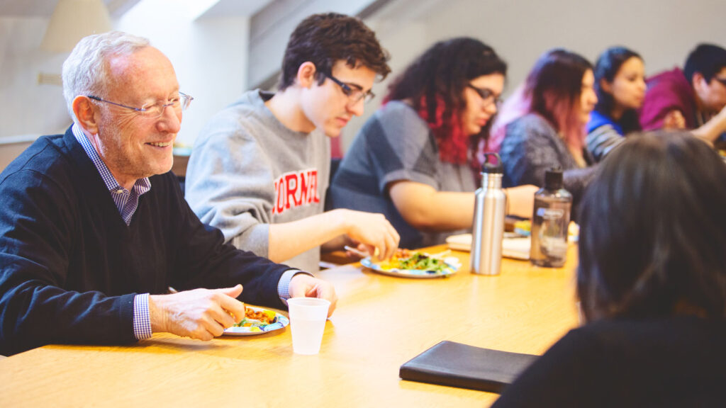 then-Provost Michael Kotlikoff chats with students at a 2016 Latino Studies “Fridays with Faculty” Lunch