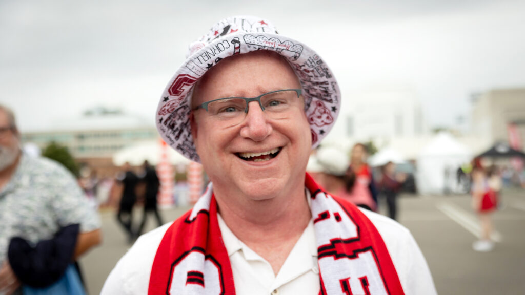 a Cornell hat-wearing fan during the Big Red Fan Festival at Homecoming 2024