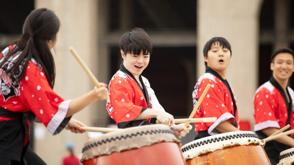 members of Cornell Yamatai, the University’s Taiko drumming group, perform at the Big Red Fan Festival during Homecoming 2024