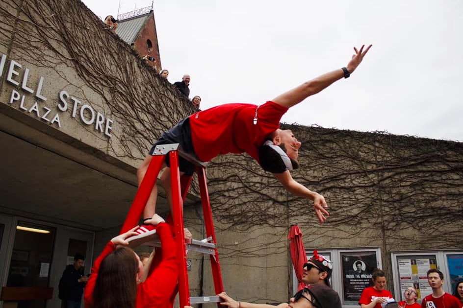 a member of the Big Red Marching Band "aardvarks" in front of the Cornell Store on Ho Plaza in 2019