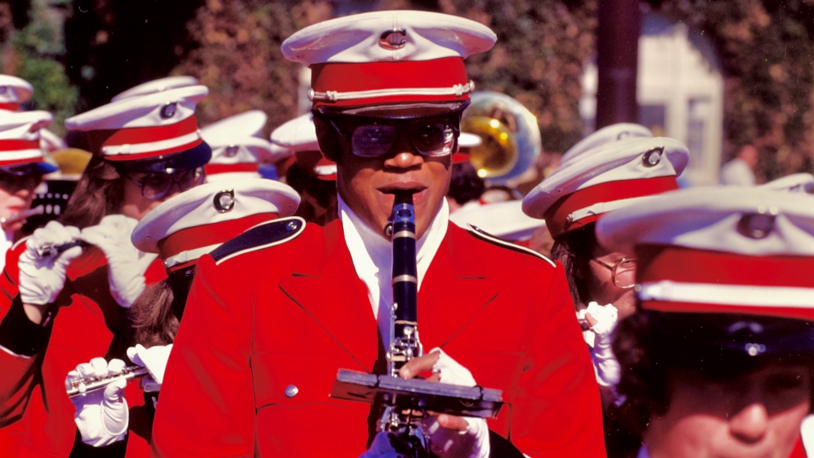 A clarinetist and other band members march in 1978