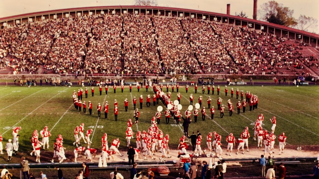 The marching band, in all its glory, on Schoellkopf Field during a Big Red football game in 1970