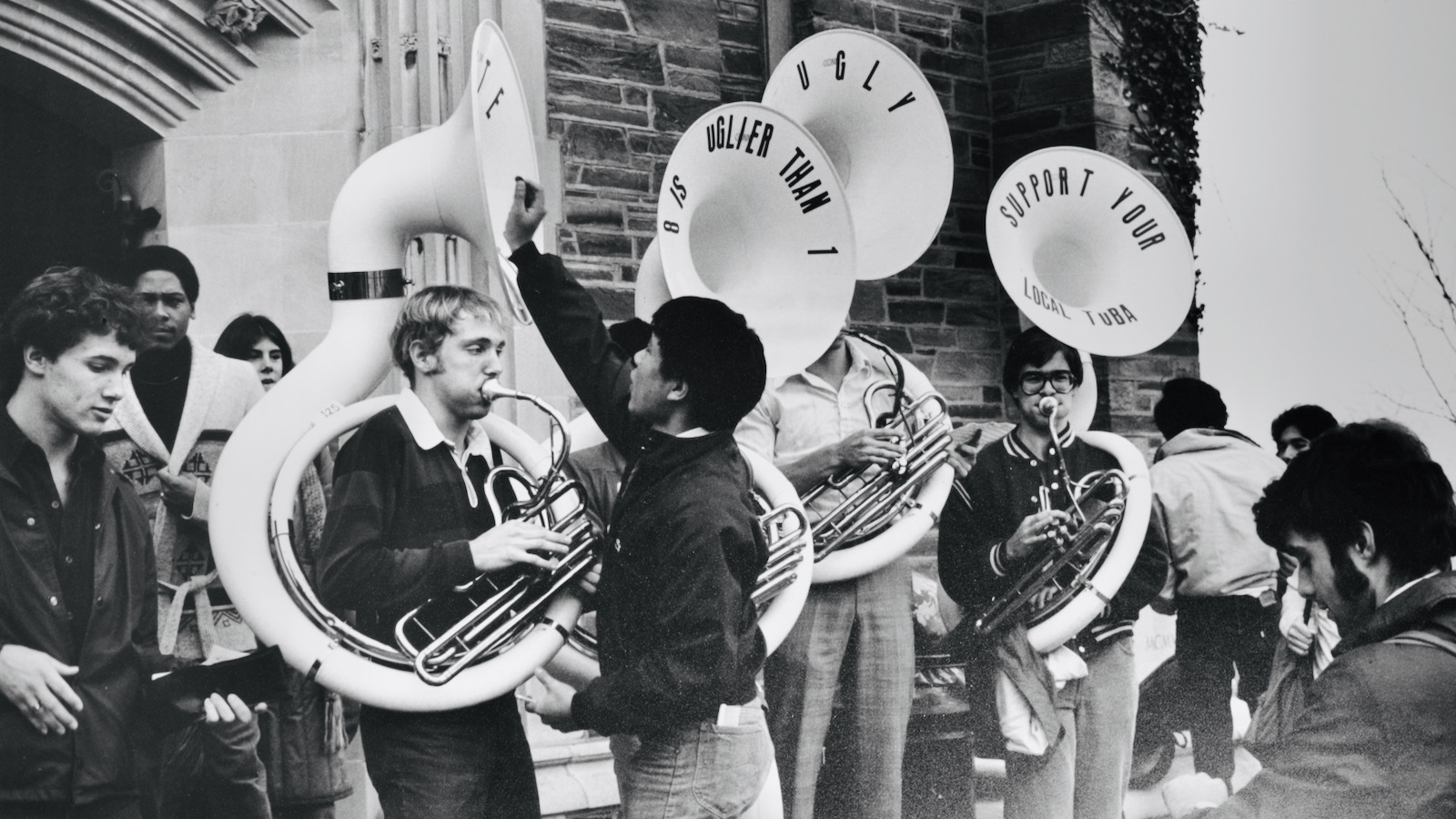 tuba section players in front of Willard Straight Hall in the 1980s