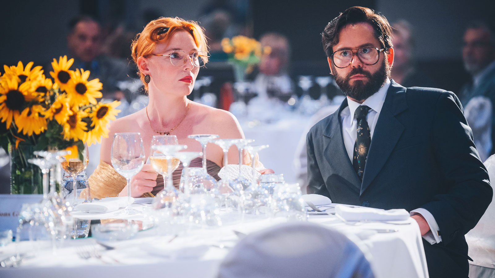 A movie scene of Rob and Terry Ryan at the award dinner