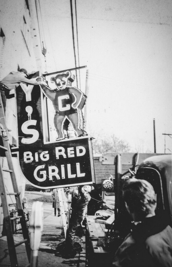 The Johnny's Big Red Grill sign is installed on the side of 202 Dryden Road in 1949