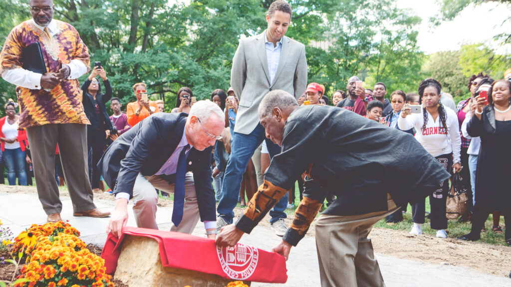 then-Provost Michael Kotlikoff and professor emeritus James Turner unveil a commemoration stone during the Africana Commemoration Dedication Ceremony in Ithaca in 2016