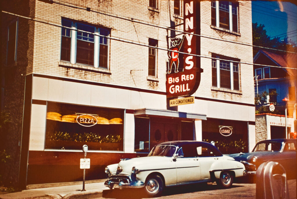 Early color image of Johnny's Big Red Grill and the sign outside the building in the early 1950s