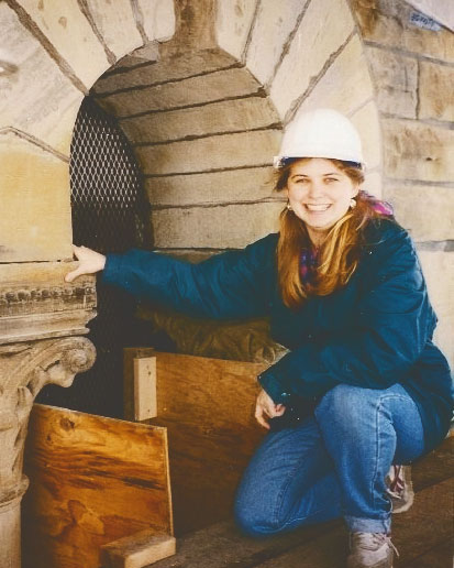 Jennifer Lory-Moran with a hard construction hat on during the 1998 renovation of McGraw Tower.