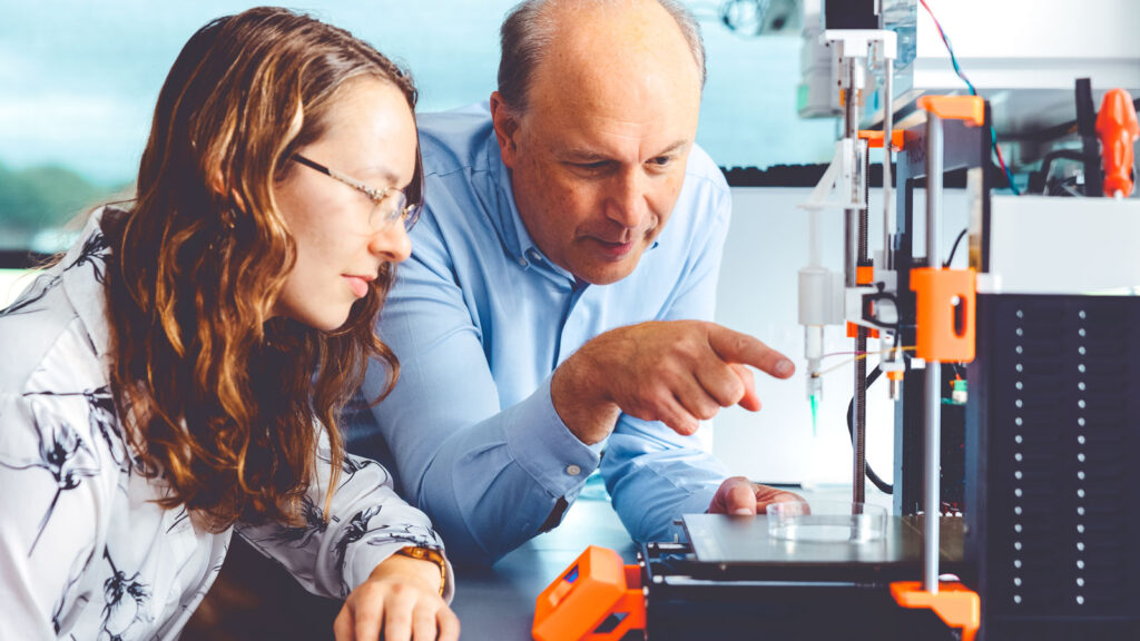 Lawrence Bonassar, the Daljit S. and Elaine Sarkaria Professor in Biomedical Engineering and in Mechanical and Aerospace Engineering, and doctoral student Alicia Matavosian examine a smart sensor developed with Jared Matthews ’21.