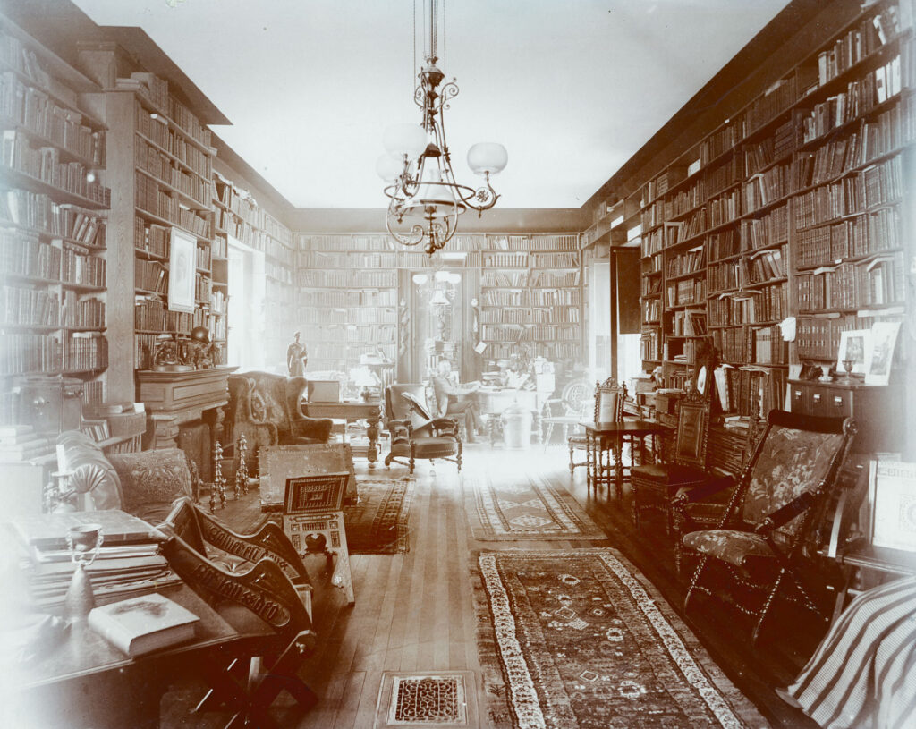 Andrew Dickson White in his library in the President's House, circa 1885–91