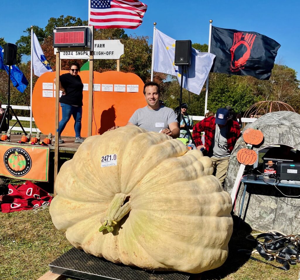 Alex Noel with a giant pumpkin weighing 2471.0 pounds