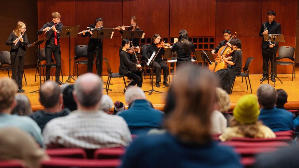 Cornell Orchestra members perform the introduction to composer Charles Ives’ “The Unanswered Question” during the Carl Sagan 90th birthday event in Call Auditorium