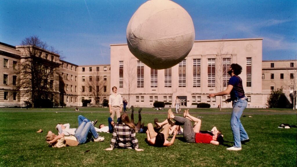 students play with a medicine ball on the Ag Quad in an undated image
