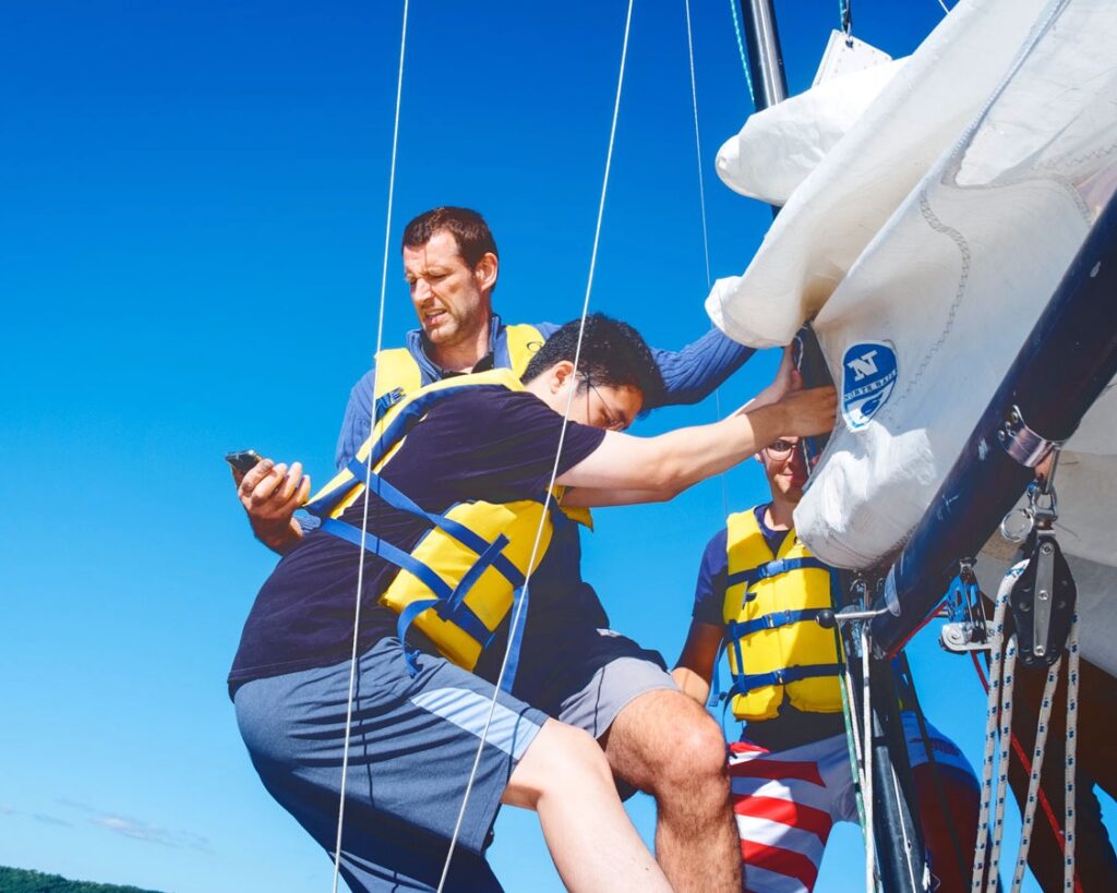 students and the professor rock the sailboat to measure its free rolling frequency