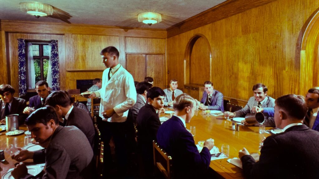 A typical fraternity dining hour is shown in an image from 1967