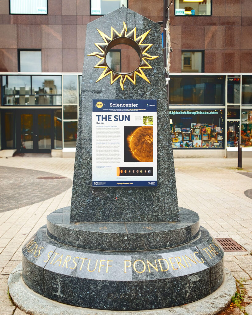 The sun monument that is the beginning of the Carl Sagan Planet Walk, located on the Ithaca Commons