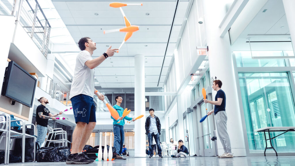 Members of the Cornell Juggling Club juggle together in the Physical Science Building.