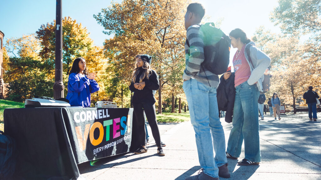 Members of the Cornell Policy Group assist with voter registration for Cornell Votes on Ho Plaza.