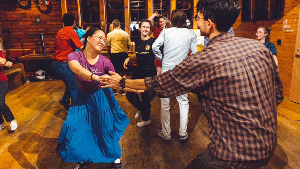 Dancers in the Big Red Barn at the Swing Syndicate group during a dance.