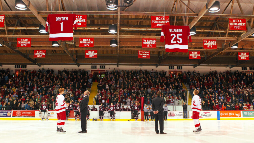 Cornell Hockey Hall of Fame members Ken Dryden and Joe Nieuwendyk watch their jerseys rise to the Lynah Rink rafters as their numbers are officially retired at a ceremony during the 2009-10 season