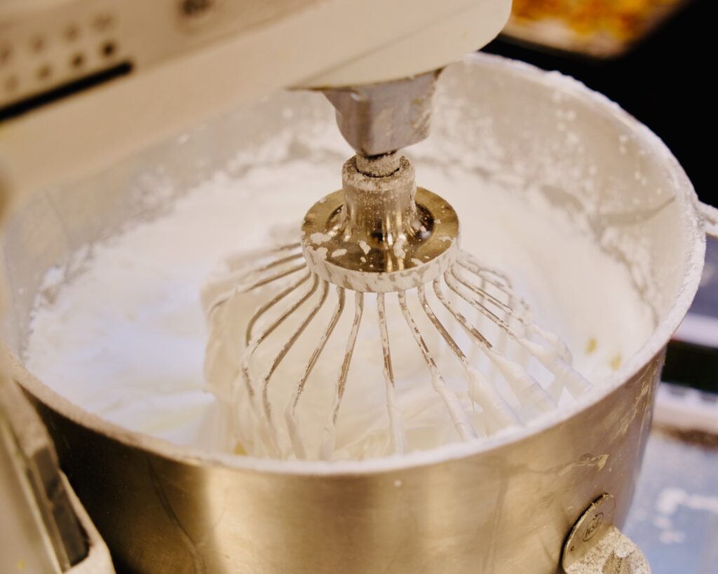 royal icing is mixed in the Cornell Club–NYC kitchen in preparation for making a gingerbread McGraw Tower