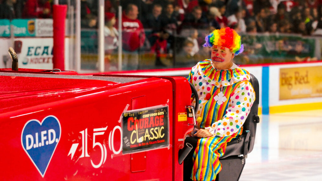 Dave Nulle helms Lynah’s ice resurfacer, decked out in a colorful clown costume, during a game against Colgate