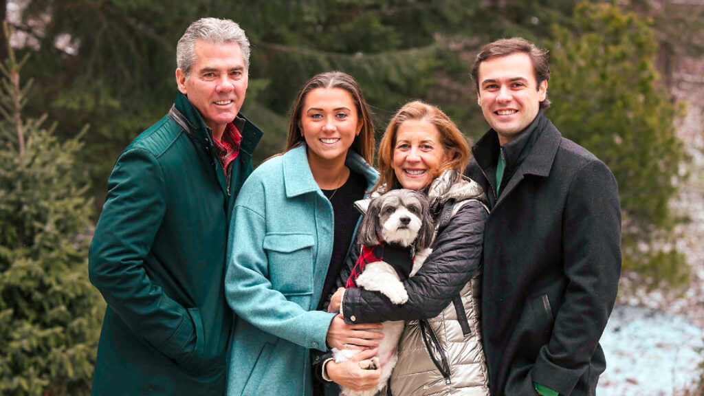 Beth Dessen Duffy ’82 and Dan Duffy ’82 with their children and dog.