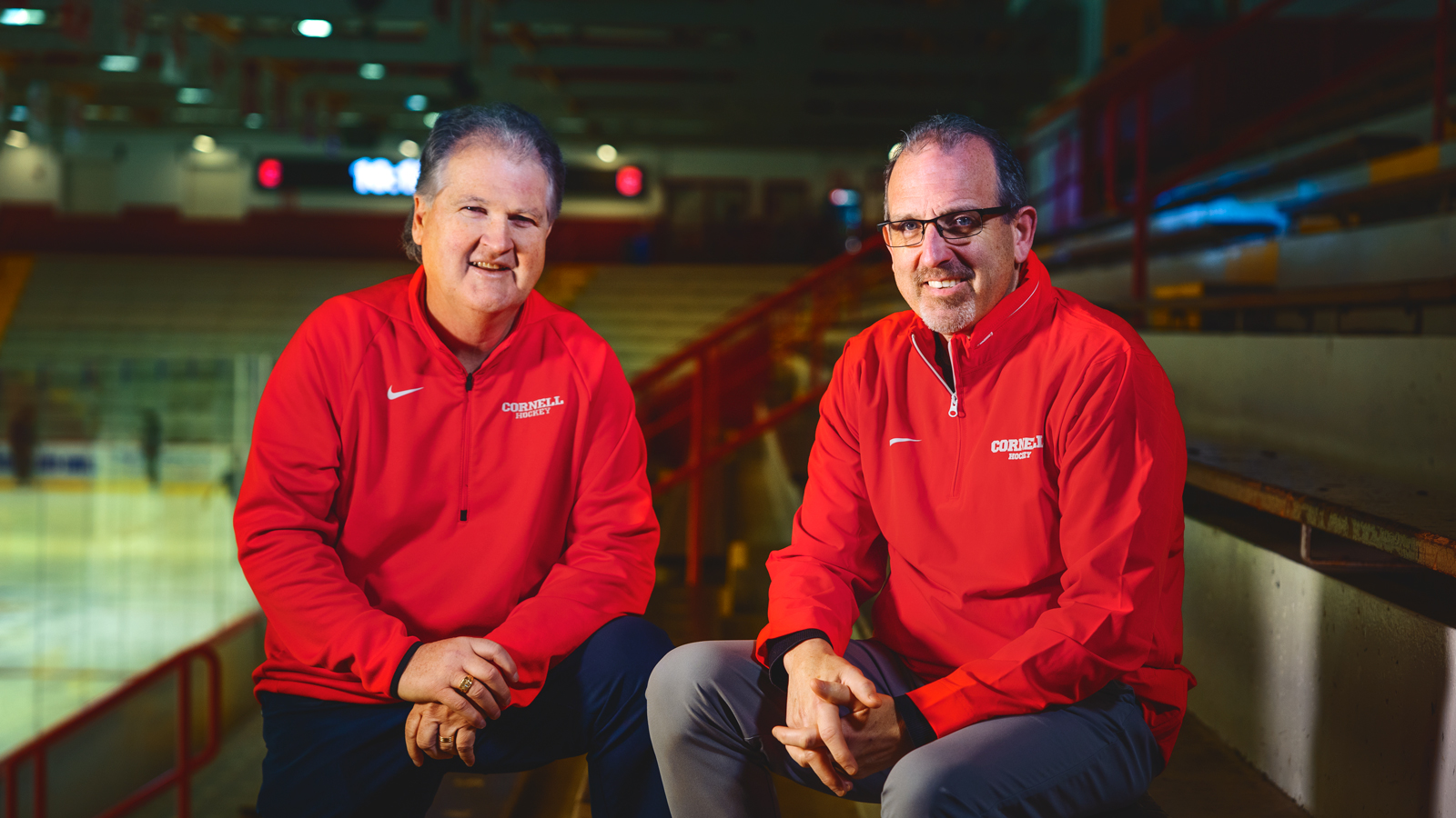 Hockey Head Coach Mike Schafer poses for a portrait with incoming Head Coach Casey Jones at Lynah Rink on Wednesday, November 13, 2024. (Ryan Young / Cornell University)