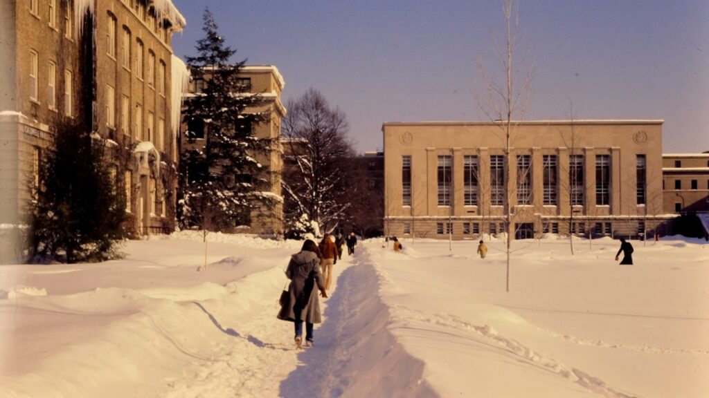 students walk through the Ag Quad amid deep snowdrifts in 1978