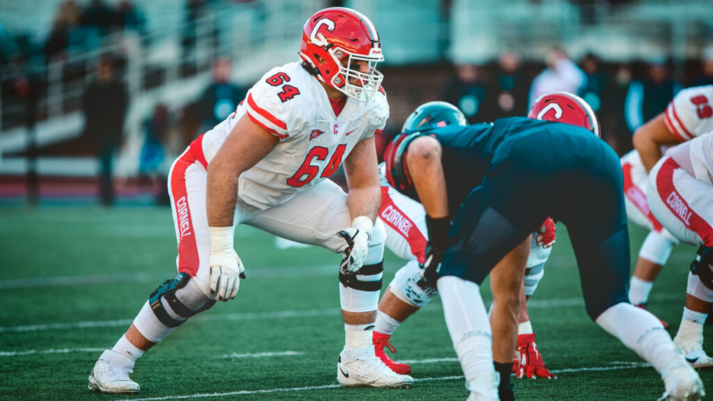 Hunter Nourzad and the football team competing against Penn.