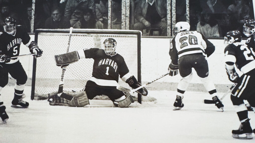 Casey Jones taking a shot on the Harvard goalie as a student player