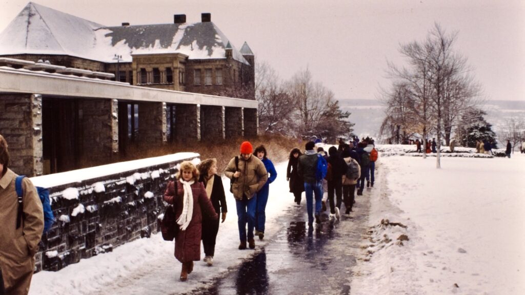 students walk outside Olin Library in snow in 1985