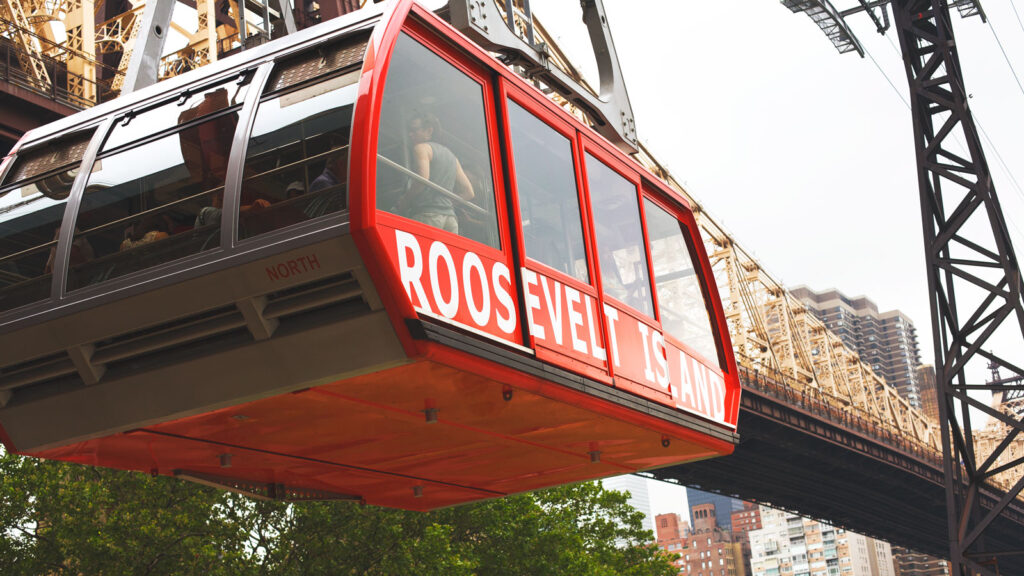 The Roosevelt Island tram with part of the Queensboro Bridge visible behind it