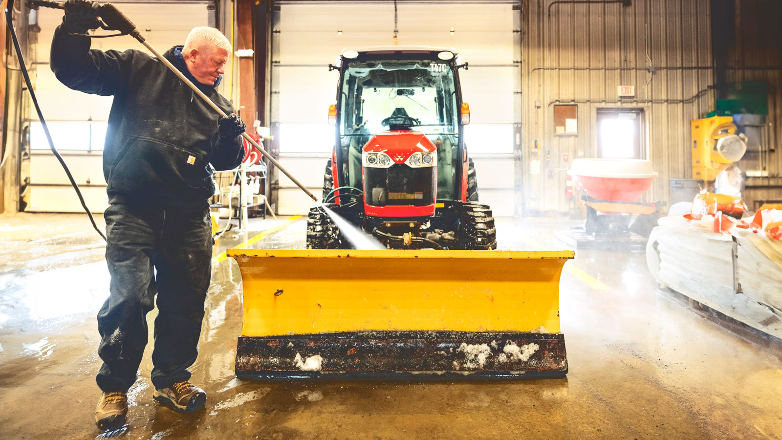 Cleaning a plow used for sidewalks in the facility at 275 East Palm Road.