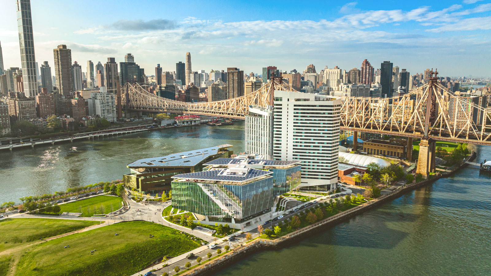 aerial view of the Cornell Tech campus on Roosevelt Island with the Queensboro Bridge and Manhattan’s Upper East Side in the background