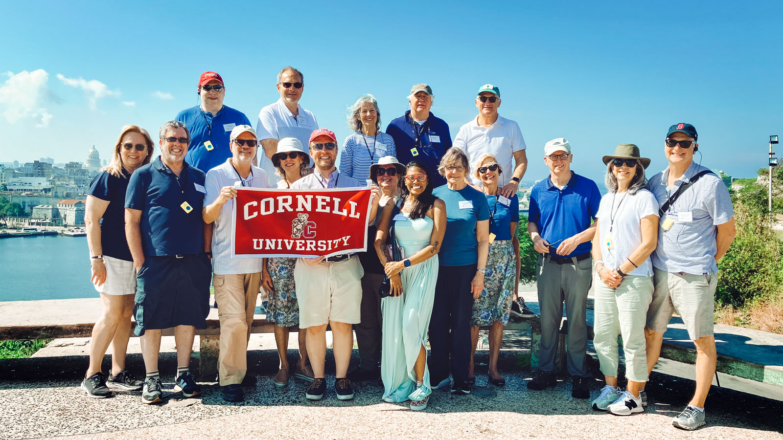 A tour group holding a Cornell University sign in Havana