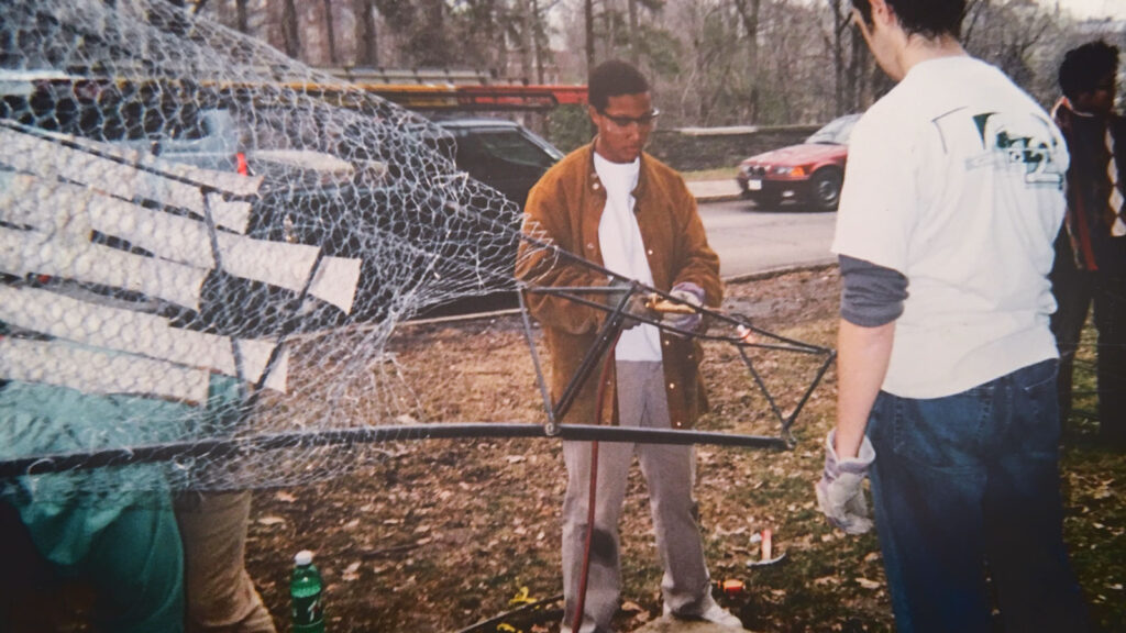 Kim Dowdell, as a first-year architecture student, at work on the dragon for Dragon Day 2002