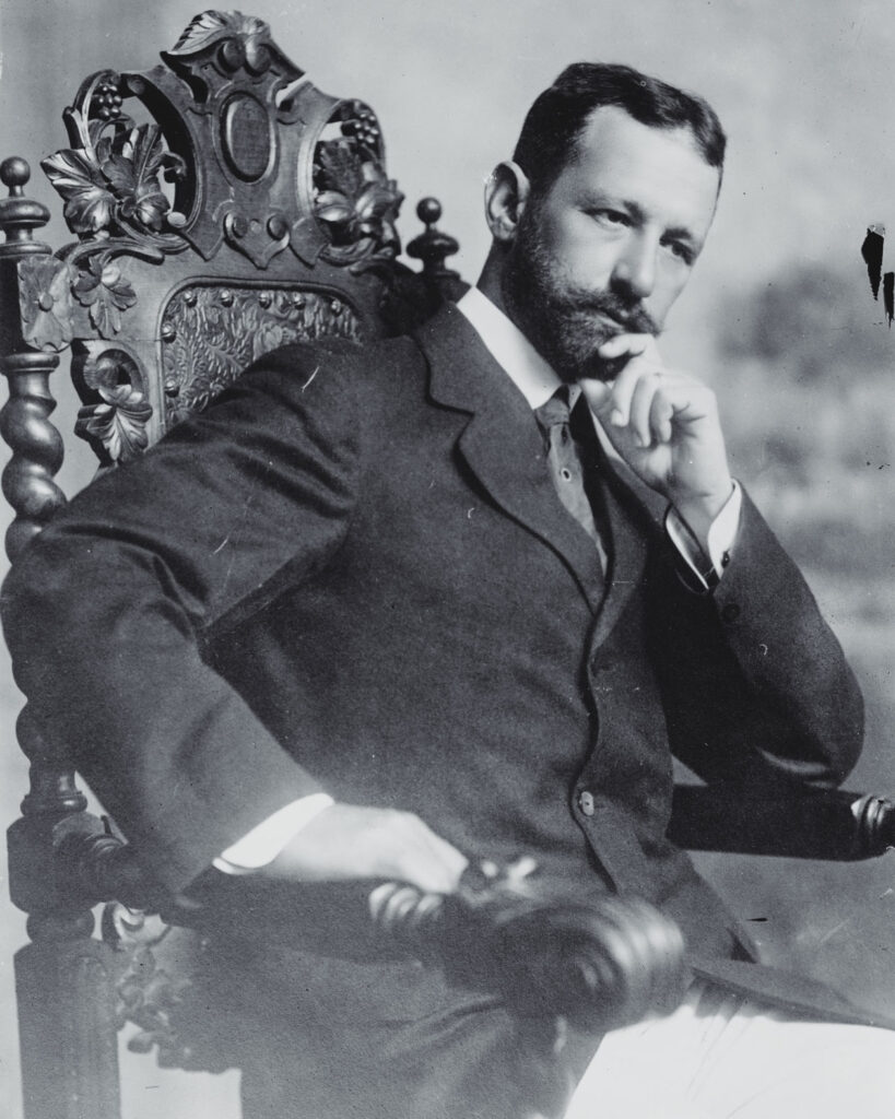 President Menocal of Cuba sitting in a carved wooden chair