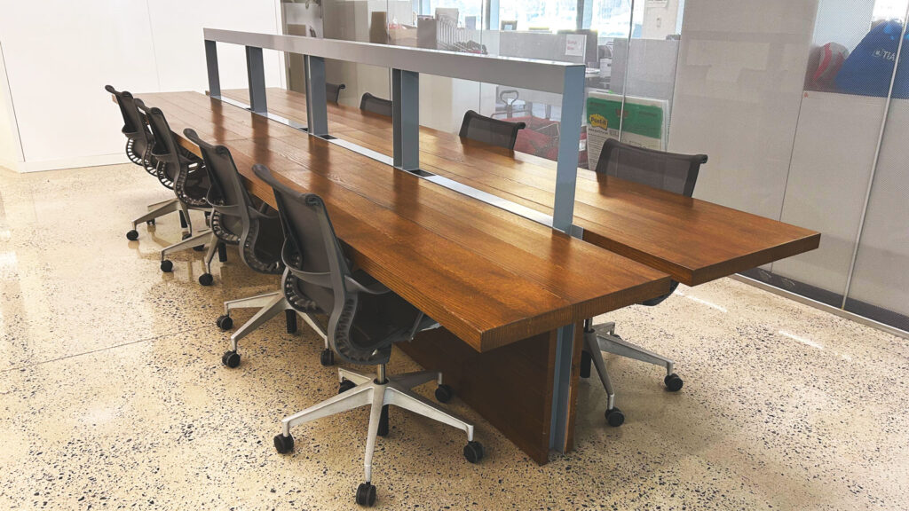 Two large work tables in Cornell Tech’s Bloomberg Center made from two pin oak trees that had to be removed for campus construction