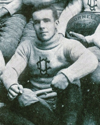 Winchester Osgood sitting in his Cornell football uniform