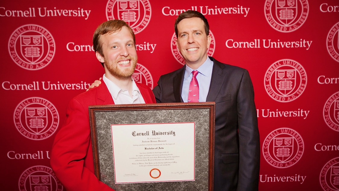 Corey Ryan Earle ’07 poses with 2014 Convocation speaker and actor Ed Helms, along with an honorary degree for "Andrew Baines Bernard," Helms’ character on "The Office."