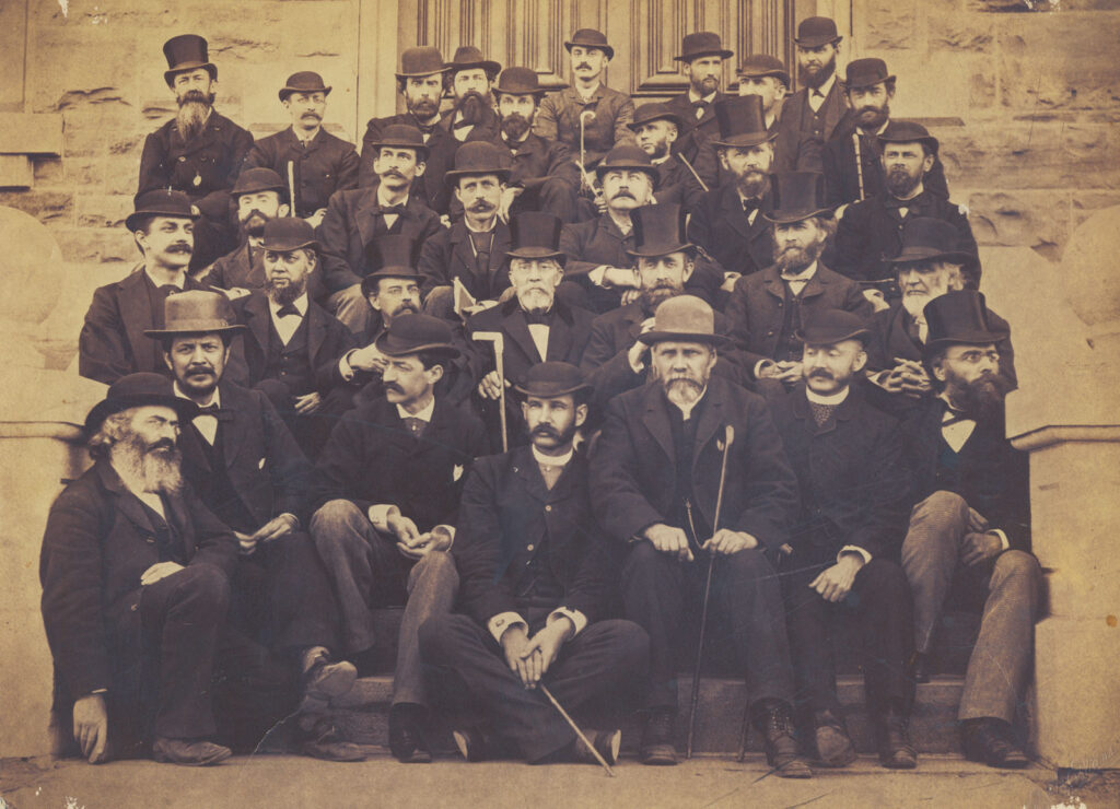 President Andrew Dickson White (second row, third from right), pictured with the University faculty in 1882