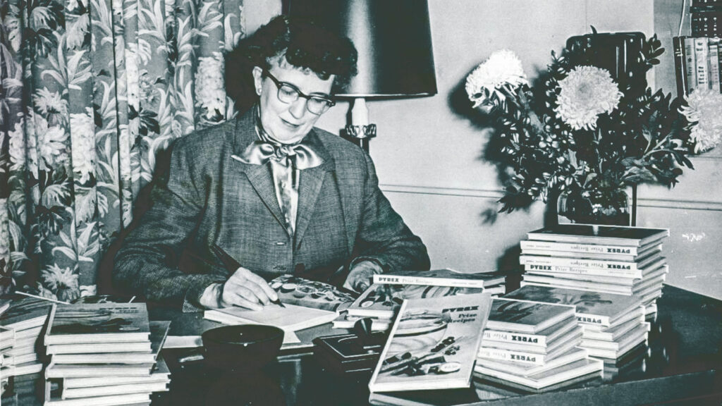 Lucy Maltby signs Pyrex cookbooks at Corning in an undated photo