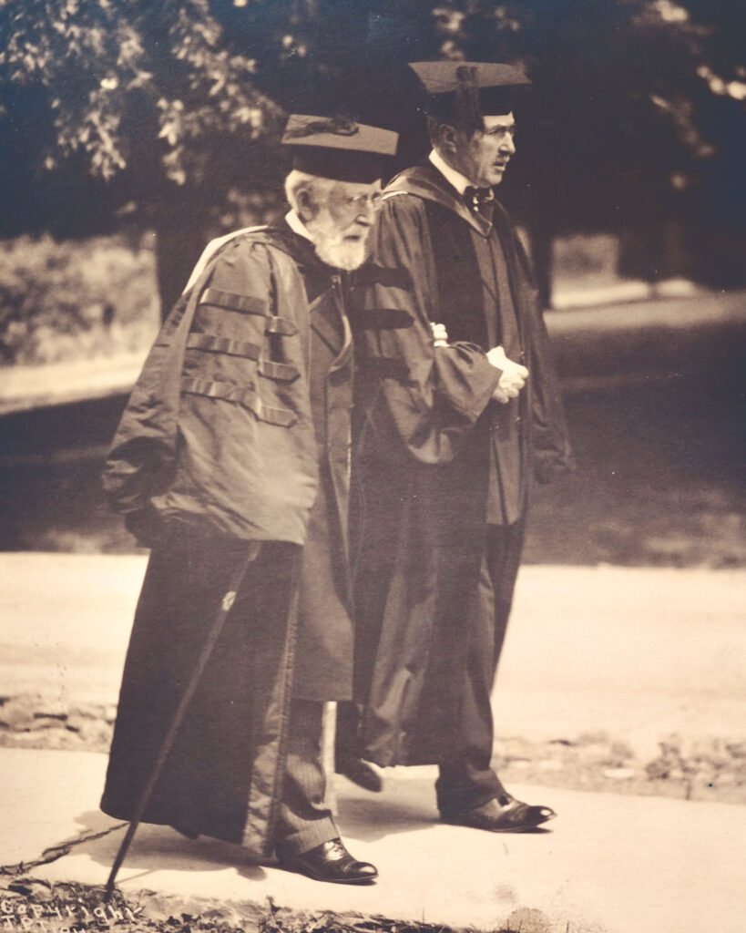 Andrew Dickson White walks with Frank Hiscock 1875, New York State Supreme Court Justice and Chair of the Board of Trustees, at a Commencement event