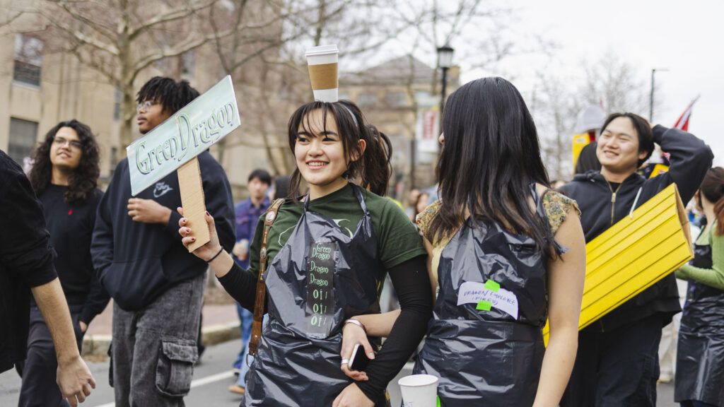 parade participants march in costume during Dragon Day 2025