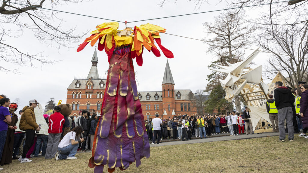 view of the phoenix and spectators as the dragon arrives during Dragon Day 2025